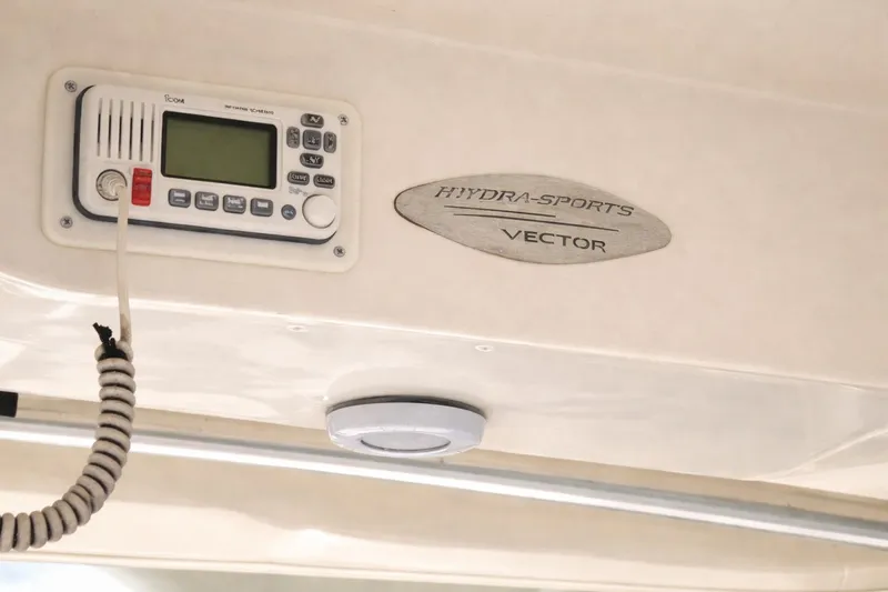 Slide: The Image of 2008 Hydra-Sports Vector 2900 CC boat interior with radio and logo detail. - 22