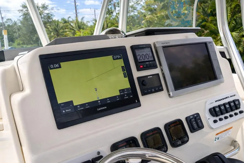 Slide: The Image of 2008 Hydra-Sports Vector 2900 CC dashboard with Garmin navigation and control panels. - 25