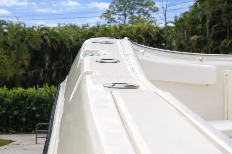 Slide: The Image of 2008 Hydra-Sports Vector 2900 CC boat deck with lush greenery background. - 26