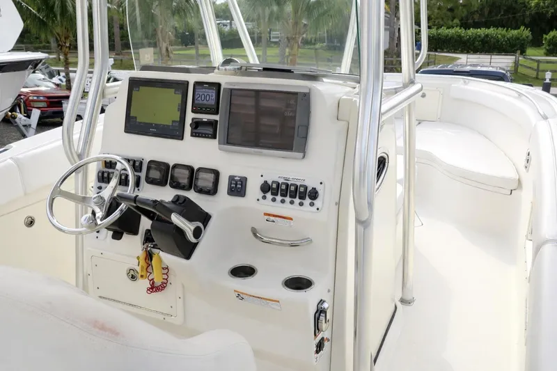 Slide: The Image of 2008 Hydra-Sports Vector 2900 CC boat cockpit with steering wheel and navigation controls. - 35