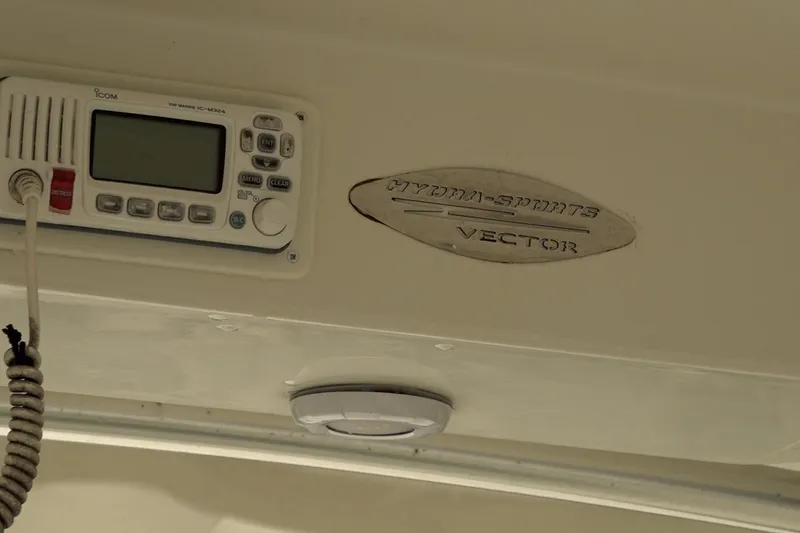 Slide: The Image of 2008 Hydra-Sports Vector 2900 CC interior with radio and logo detail. - 4