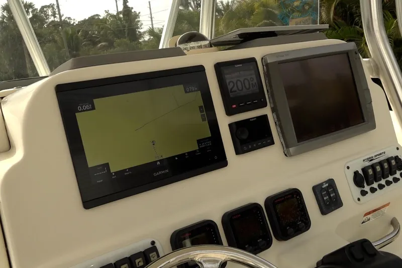 Slide: The Image of 2008 Hydra-Sports Vector 2900 CC dashboard with navigation and control systems. - 7