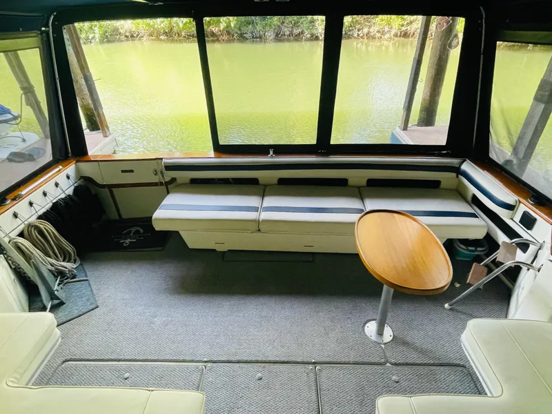 Slide: The Image of Interior of 1989 Sea Ray 390 Express Cruiser with seating area. - 23
