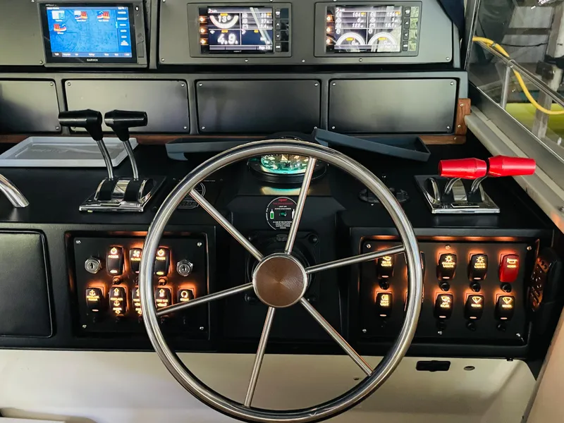Slide: The Image of 1989 Sea Ray 390 Express Cruiser helm console. - 29