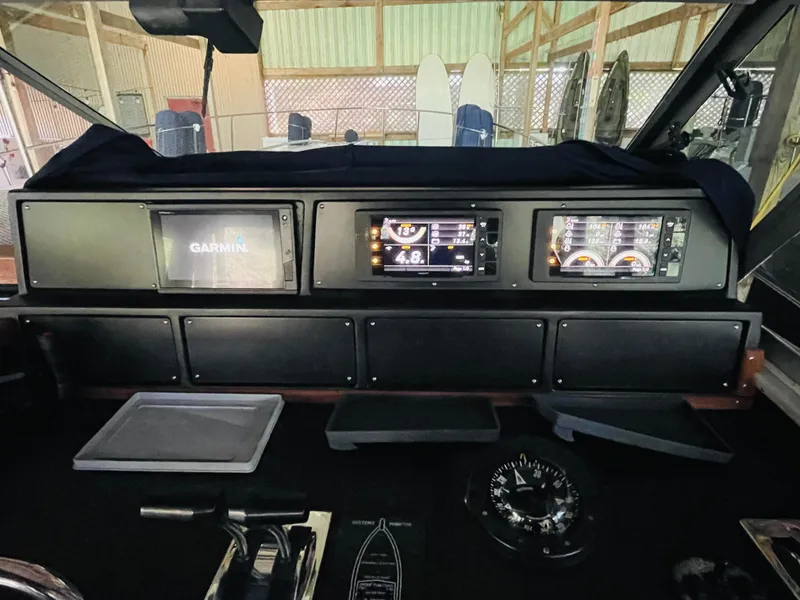 Slide: The Image of Dashboard of a 1989 Sea Ray 390 Express Cruiser with Garmin navigation. - 30