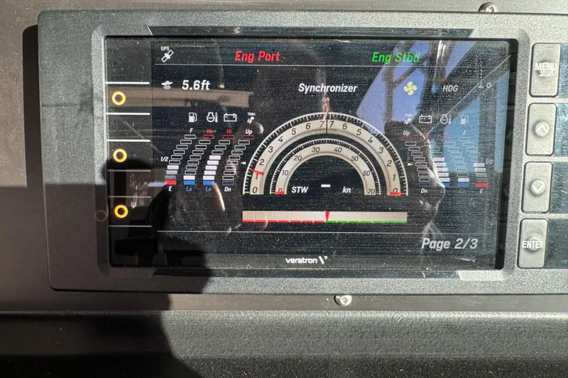 Slide: The Image of Dashboard display of a 1989 Sea Ray 390 Express Cruiser showing engine and navigation data. - 33