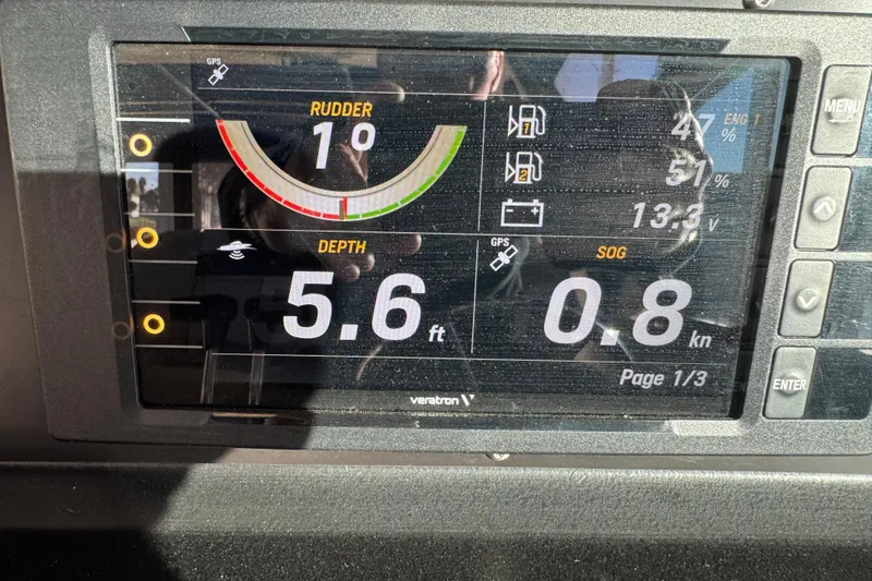Slide: The Image of Dashboard display of 1989 Sea Ray 390 Express Cruiser showing rudder, depth, and speed. - 36