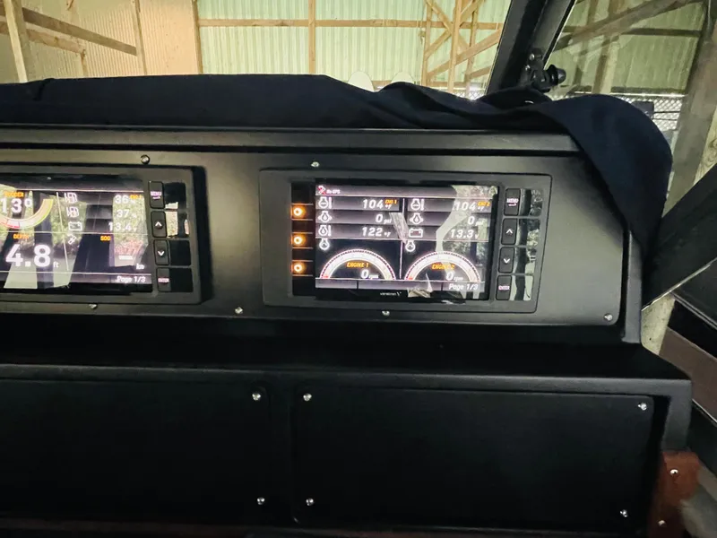 Slide: The Image of Dashboard of 1989 Sea Ray 390 Express Cruiser with digital displays. - 40