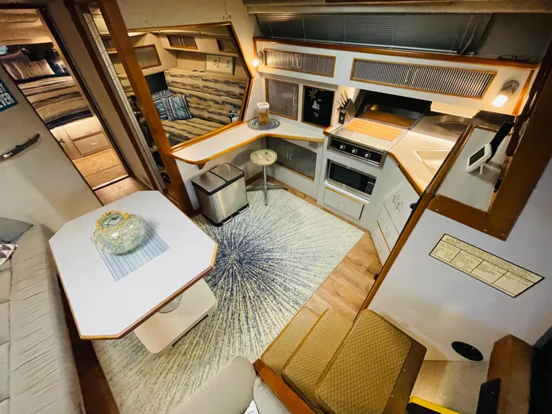 Slide: The Image of Interior of 1989 Sea Ray 390 Express Cruiser, cozy and stylishly furnished. - 44