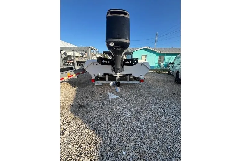 Slide: The Image of Rear view of a 2007 Talon F21 boat on a gravel driveway. - 5
