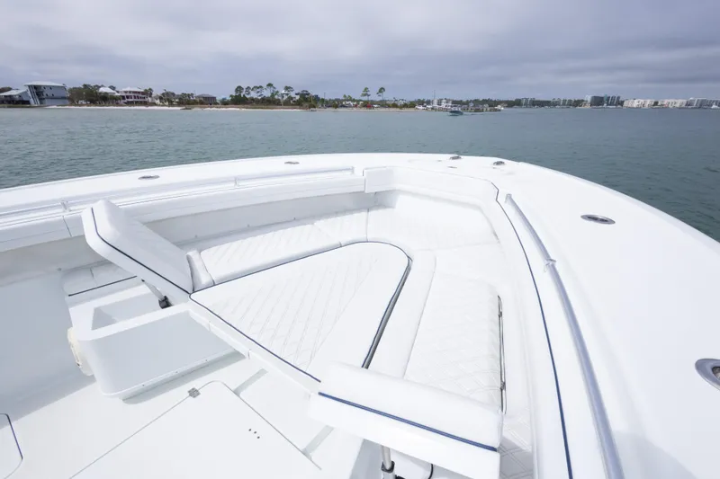 Slide: The Image of 2020 Yellowfin 42 Offshore boat with spacious white seating area on calm water. - 3