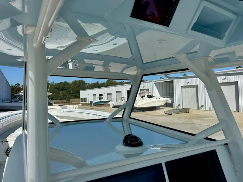 Slide: The Image of 2020 Yellowfin 42 Offshore boat with four Mercury 400 engines on the water. - 32