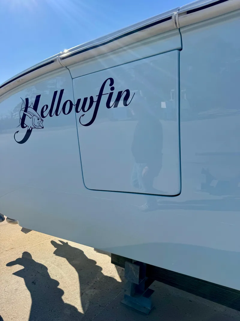 Slide: The Image of 2020 Yellowfin 42 Offshore boat with quad engines, spacious deck, and scenic waterfront view. - 6