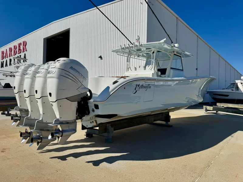 Slide: The Image of 2020 Yellowfin 42 Offshore boat with four Mercury outboard engines on the water. - 8