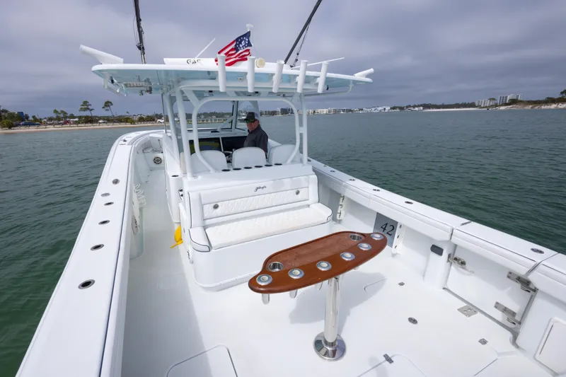 Slide: The Image of 2020 Yellowfin 42 Offshore boat on water, featuring spacious deck and fishing amenities. - 9