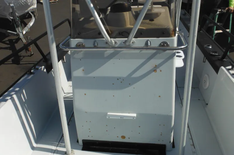 Slide: The Image of 1990 Boston Whaler Guardian 22 boat console with visible wear and rust spots. - 11