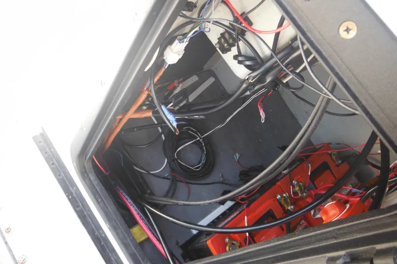 Slide: The Image of Electrical wiring and battery compartment of a 1990 Boston Whaler Guardian 22 boat. - 16