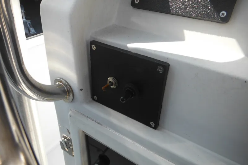 Slide: The Image of Control panel on a 1990 Boston Whaler Guardian 22 boat interior. - 26