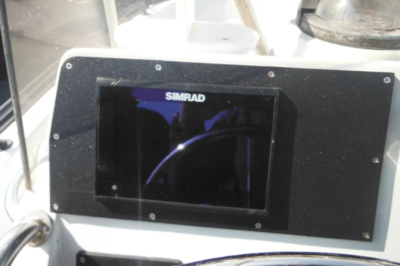 Slide: The Image of Simrad display on 1990 Boston Whaler Guardian 22 boat dashboard. - 27