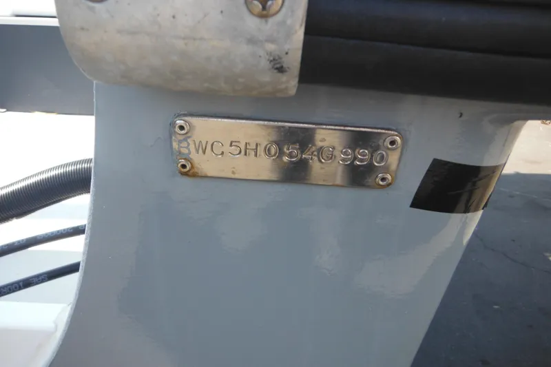 Slide: The Image of 1990 Boston Whaler Guardian 22 hull identification number plate. - 3