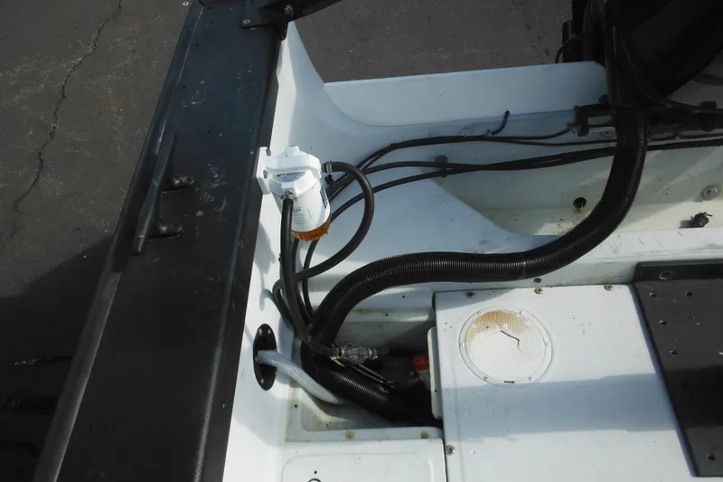 Slide: The Image of 1990 Boston Whaler Guardian 22 boat interior with visible wiring and components. - 30