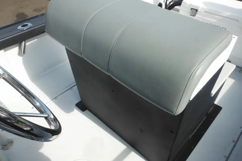 Slide: The Image of 1990 Boston Whaler Guardian 22 boat seat and steering wheel detail. - 33