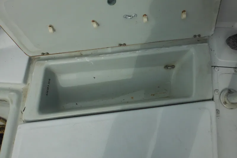 Slide: The Image of Open storage compartment on a 1990 Boston Whaler Guardian 22 boat. - 40