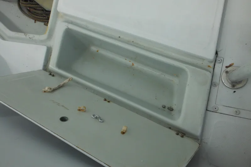 Slide: The Image of Open storage compartment on a 1990 Boston Whaler Guardian 22 boat. - 41