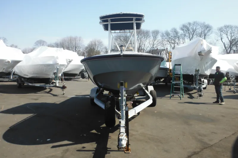 Slide: The Image of 1990 Boston Whaler Guardian 22 boat on trailer in a storage yard. - 8