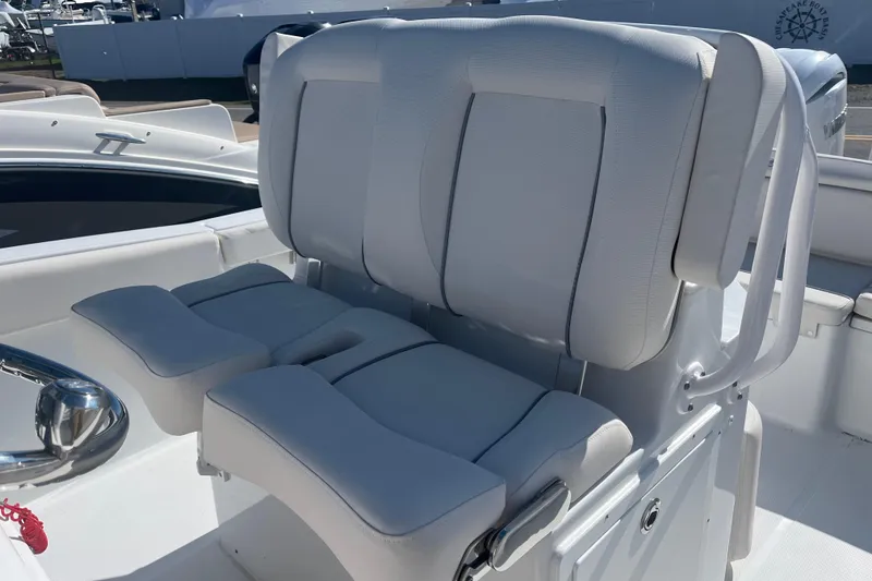 Slide: The Image of 2025 Sea Hunt Ultra 265 SE boat seating, featuring plush white upholstery and modern design. - 13