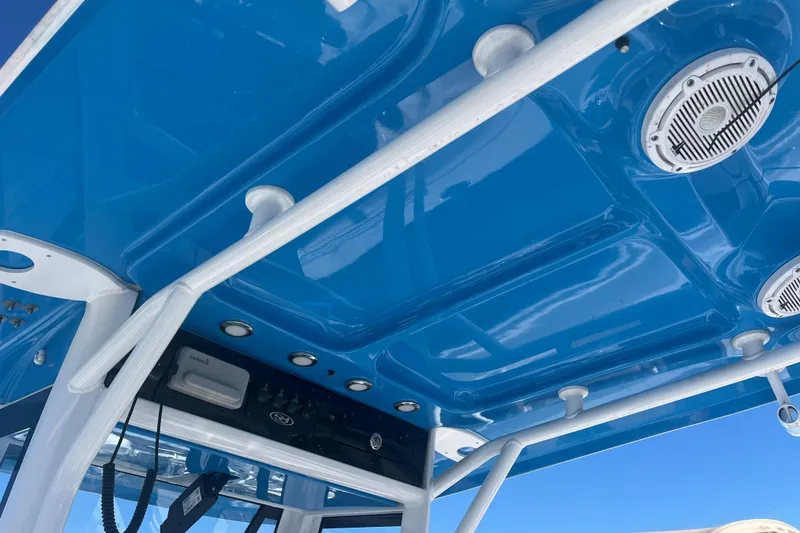 Slide: The Image of Blue interior roof of 2025 Sea Hunt Ultra 265 SE boat with speakers and lights. - 14