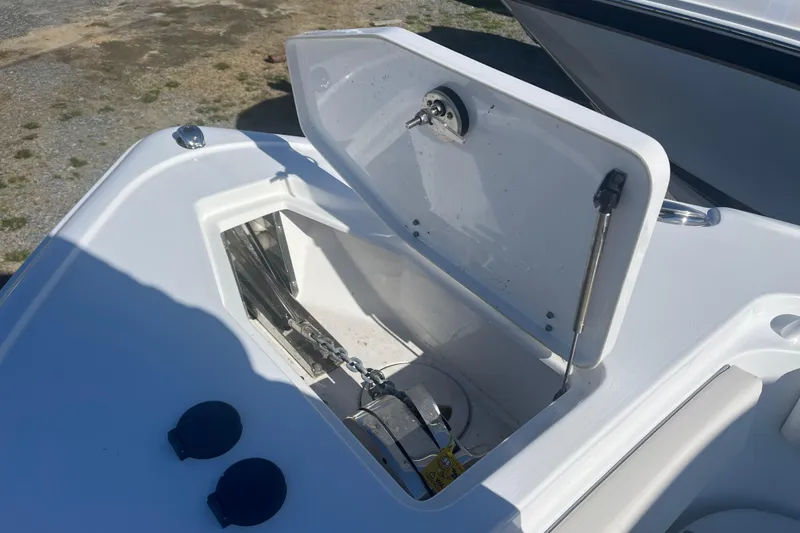 Slide: The Image of Open storage compartment on 2025 Sea Hunt Ultra 265 SE boat deck. - 19
