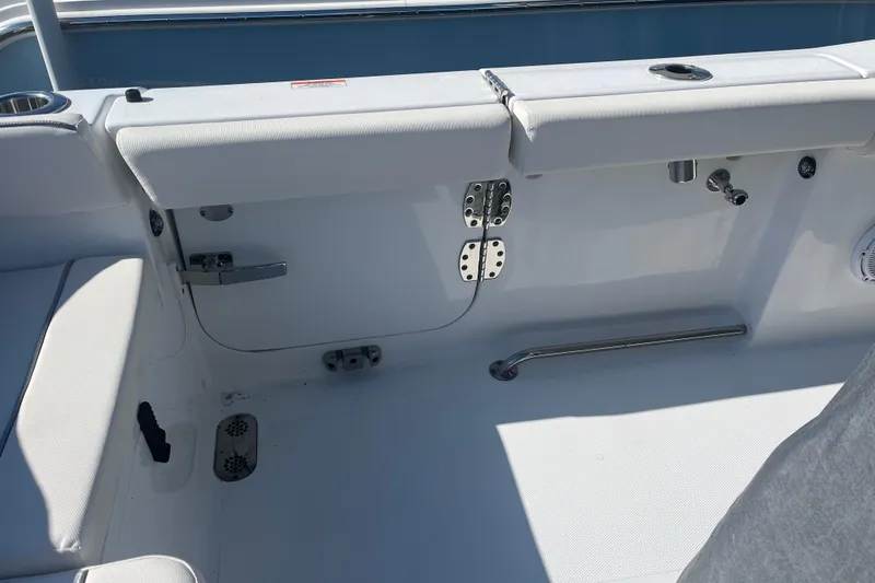 Slide: The Image of Interior view of 2025 Sea Hunt Ultra 265 SE boat, featuring seating and hardware. - 22