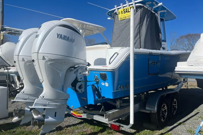 Slide: The Image of 2025 Sea Hunt Ultra 265 SE boat with Yamaha engines, for sale on trailer. - 23