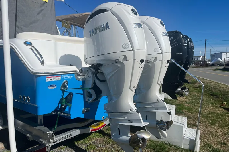 Slide: The Image of 2025 Sea Hunt Ultra 265 SE with dual Yamaha 200 engines on display. - 29