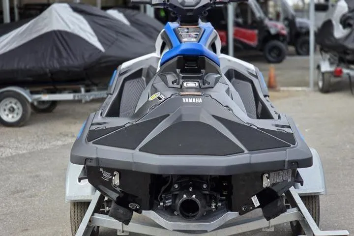 Slide: The Image of 2025 Yamaha WaveRunner JetBlaster on trailer, rear view, in a storage area. - 6