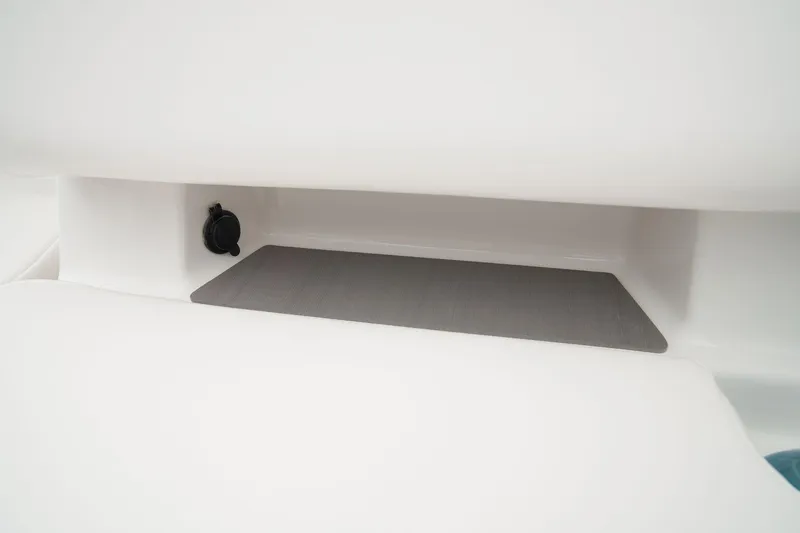 Slide: The Image of Manufacturer Provided Image: Storage compartment in 2025 Tahoe T21 boat, featuring a sleek, minimalist design. - 25