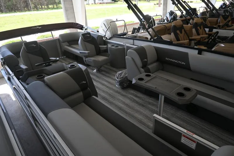 Slide: The Image of 2026 Bennington S Quad Bench 21 SSR pontoon boat interior with luxurious seating. - 10