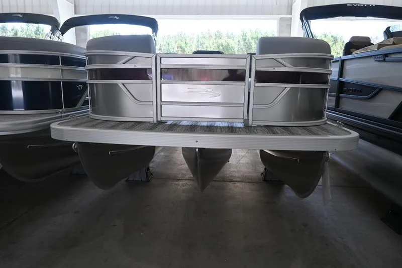 Slide: The Image of 2026 Bennington S Quad Bench 21 SSR pontoon boat in showroom display. - 4
