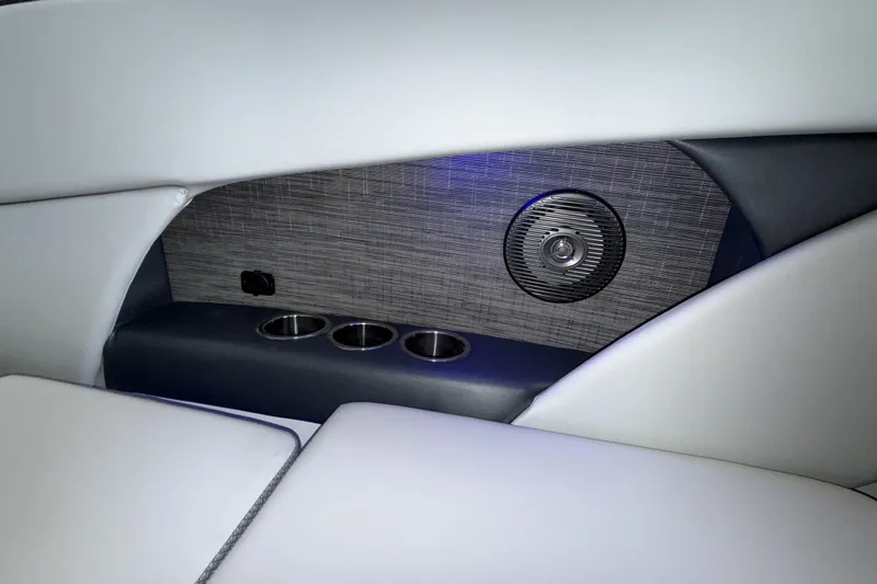 Slide: The Image of Interior of 2026 Scarab 255 SE boat with speaker and cup holders. - 15