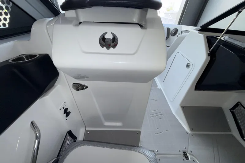 Slide: The Image of Interior of 2026 Scarab 255 SE boat, featuring sleek white design and modern controls. - 16
