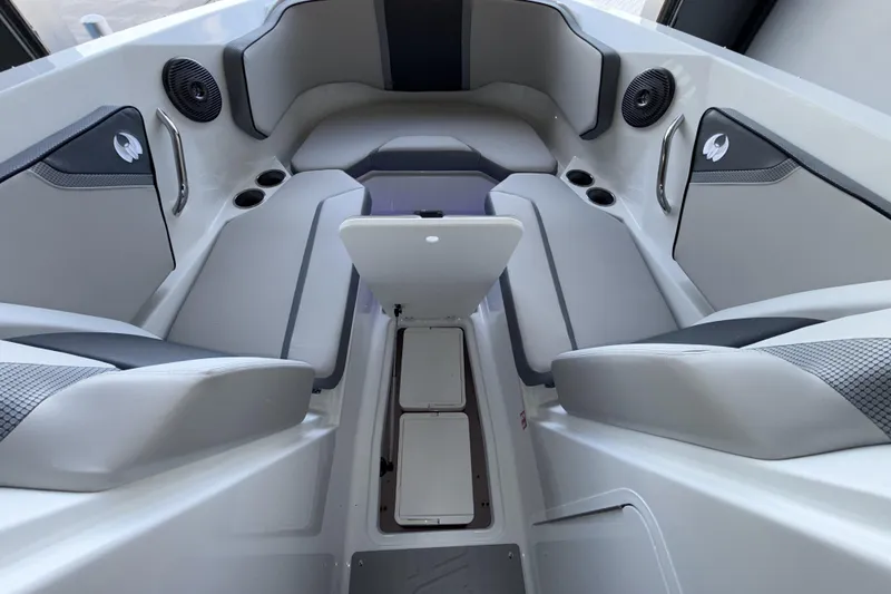 Slide: The Image of Interior of 2026 Scarab 255 SE boat with sleek seating and storage compartments. - 18