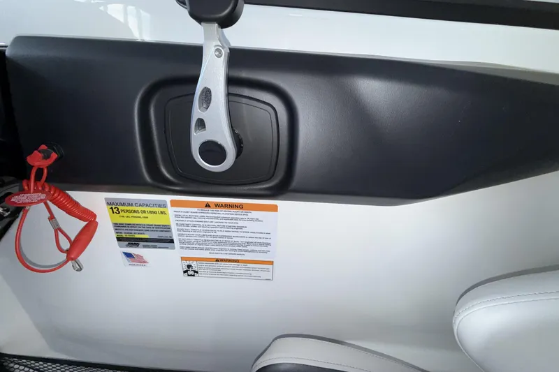 Slide: The Image of Interior of 2026 Scarab 255 SE boat with safety warnings and capacity details. - 20