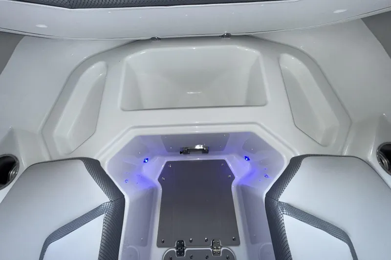Slide: The Image of Interior of 2026 Scarab 255 SE boat with modern seating and LED lighting. - 25