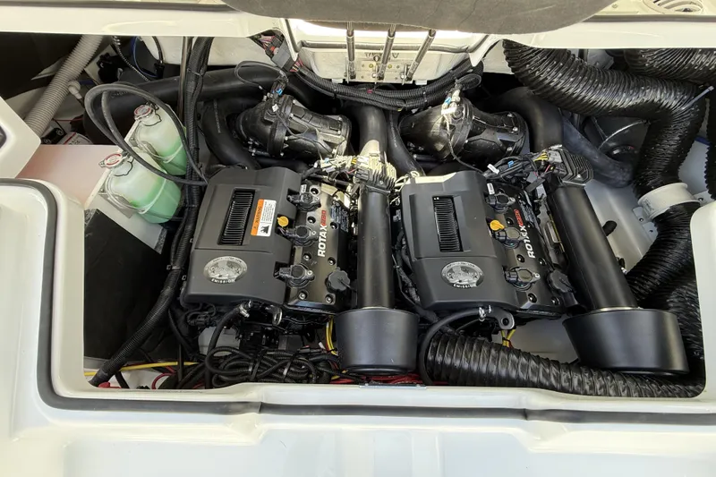 Slide: The Image of Engine compartment of 2026 Scarab 255 SE boat, featuring dual Rotax engines and cooling system. - 31