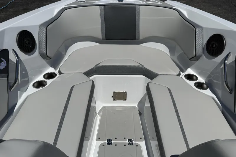 Slide: The Image of Interior of 2026 Scarab 255 SE boat with gray seating and cup holders. - 35