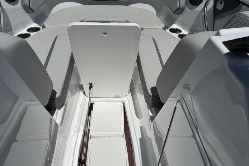 Slide: The Image of Interior view of 2026 Scarab 255 SE boat, featuring sleek seating and storage compartments. - 36