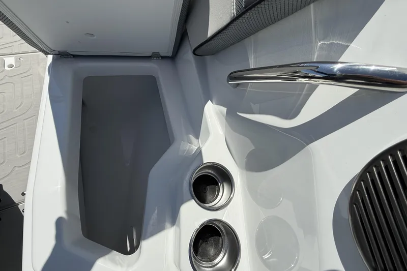 Slide: The Image of Interior view of 2026 Scarab 255 SE boat with storage compartment and cup holders. - 37