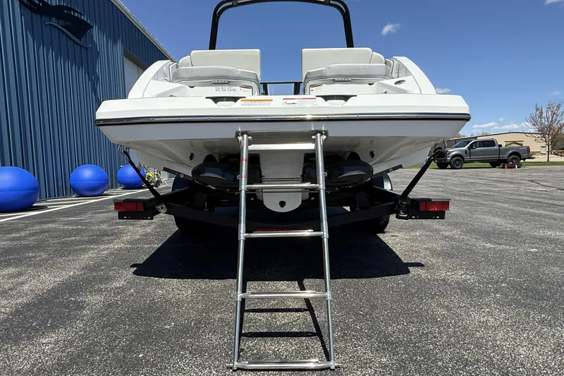 Slide: The Image of 2026 Scarab 255 SE boat rear view with ladder on trailer. - 6