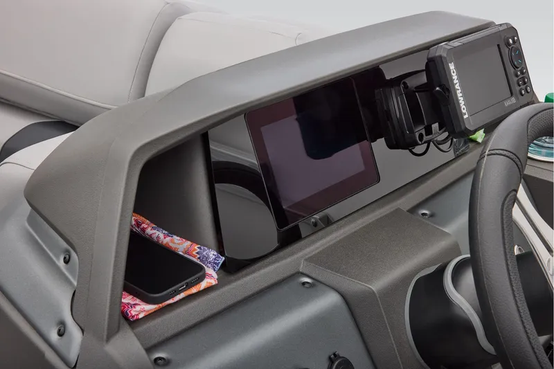 Slide: The Image of Manufacturer Provided Image: 2026 Sun Tracker SportFish 20 DLX dashboard with electronics and storage compartment. - 40